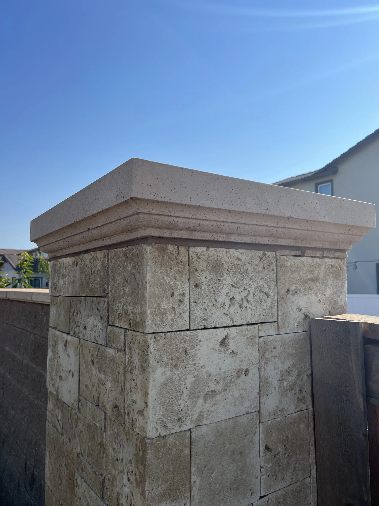 Pier cap showing its overhang and moulded edge from an angle