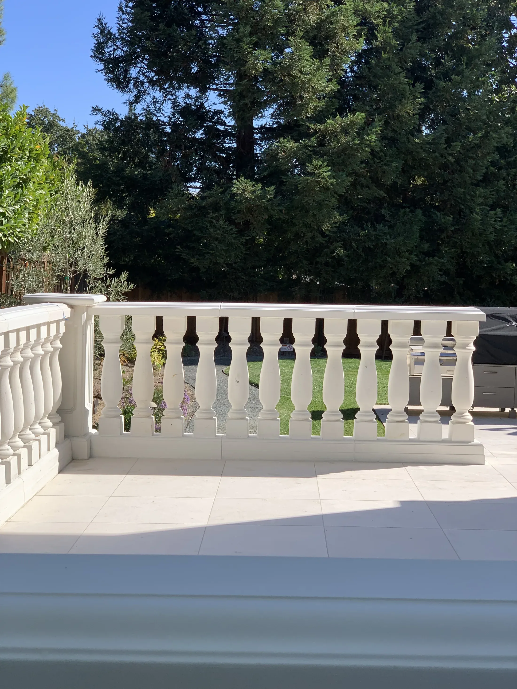 Shallow terrace steps beside a balustrade