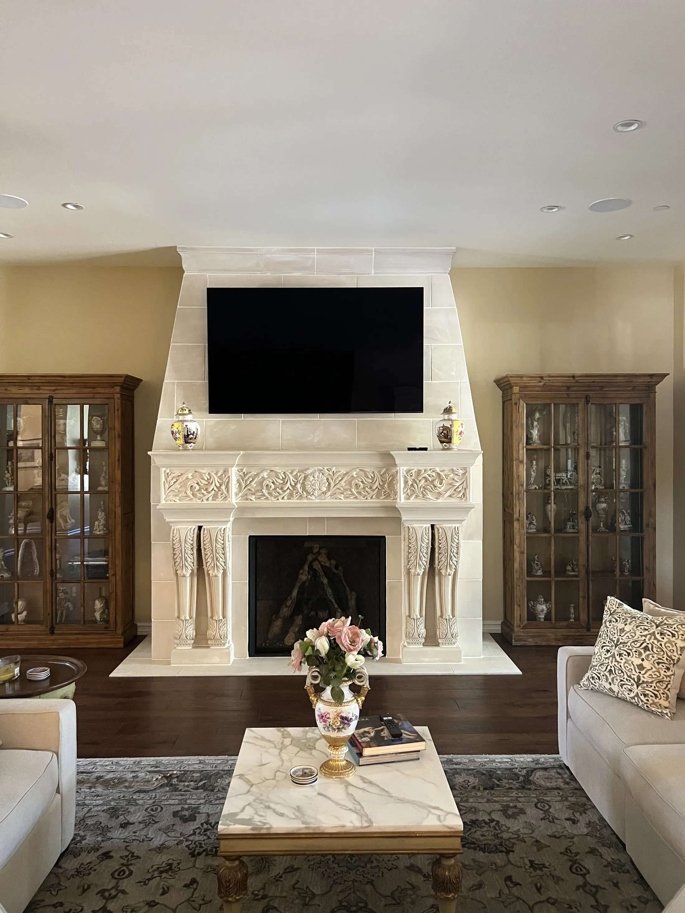 Ornamental bracket details at the sides of a fireplace surround