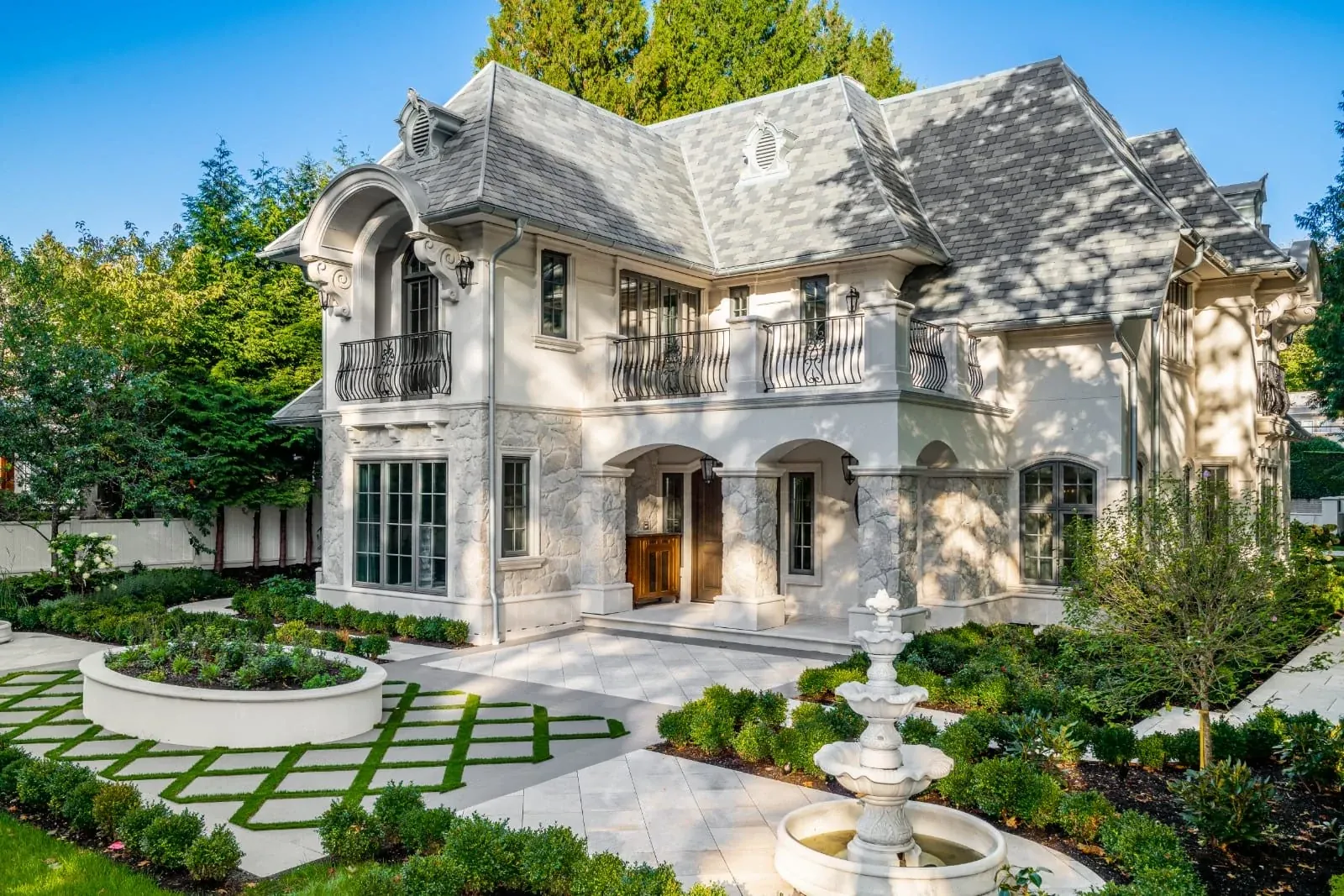 Tiered fountain in a landscaped residential entrance garden