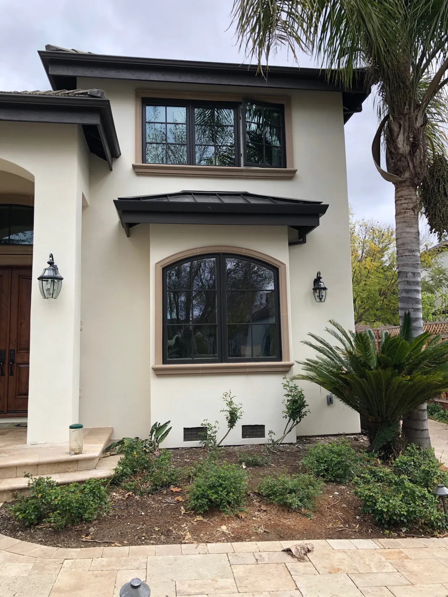 Window surrounds and projecting headers on a two-story facade