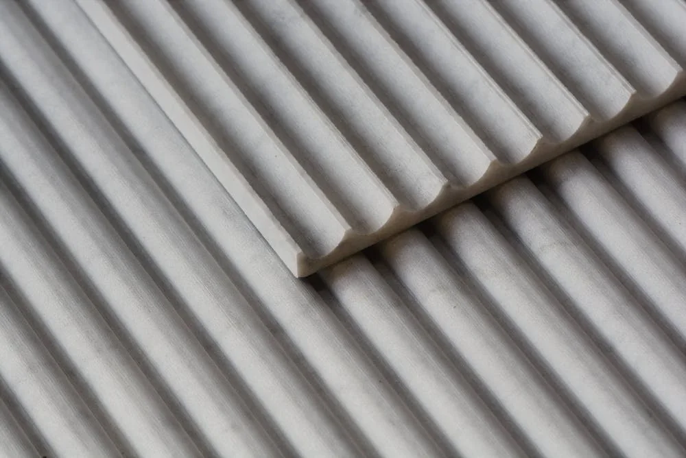 Close view of actual ribbed panel samples and their rounded relief