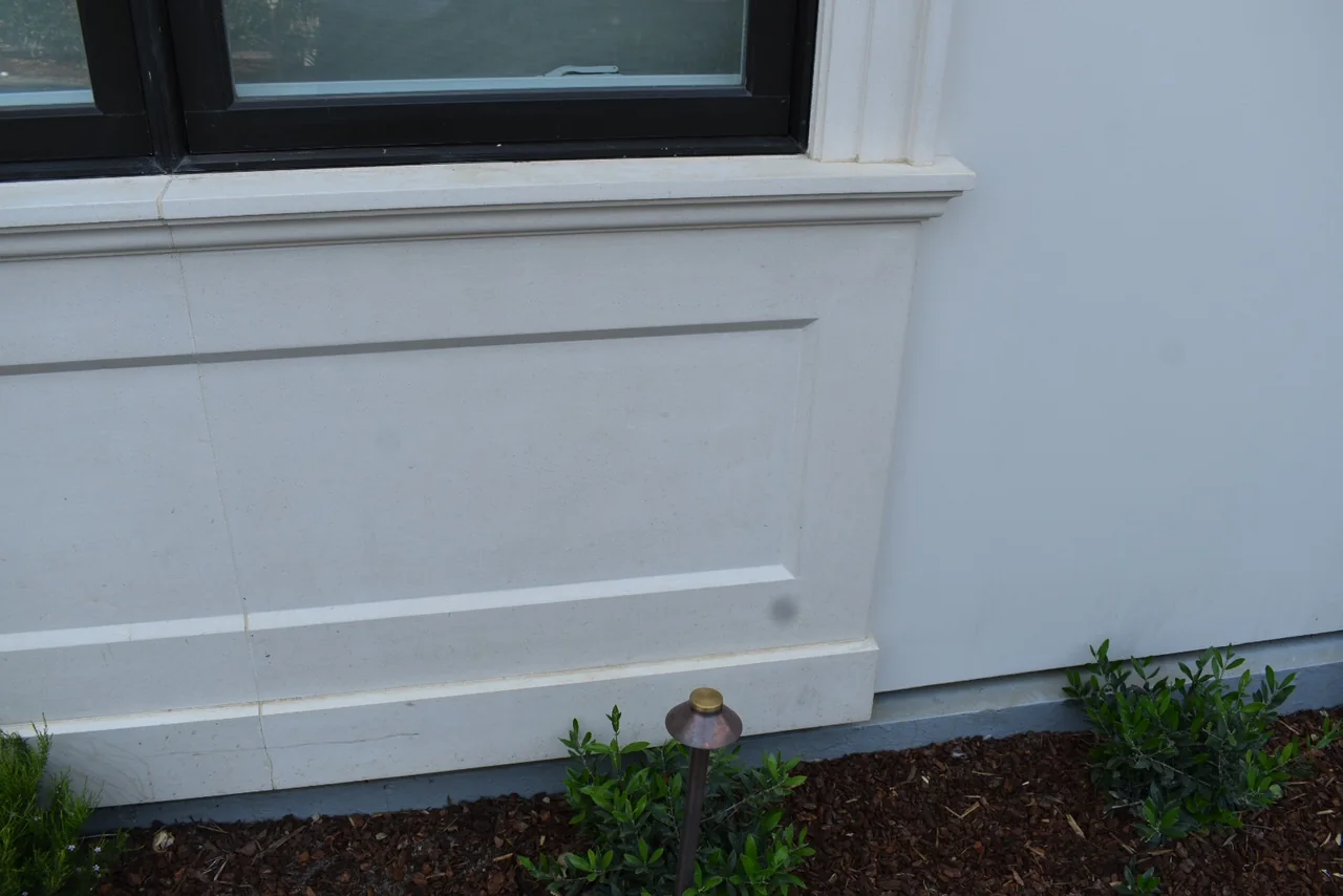 Long sill and panel beneath a multi-part window