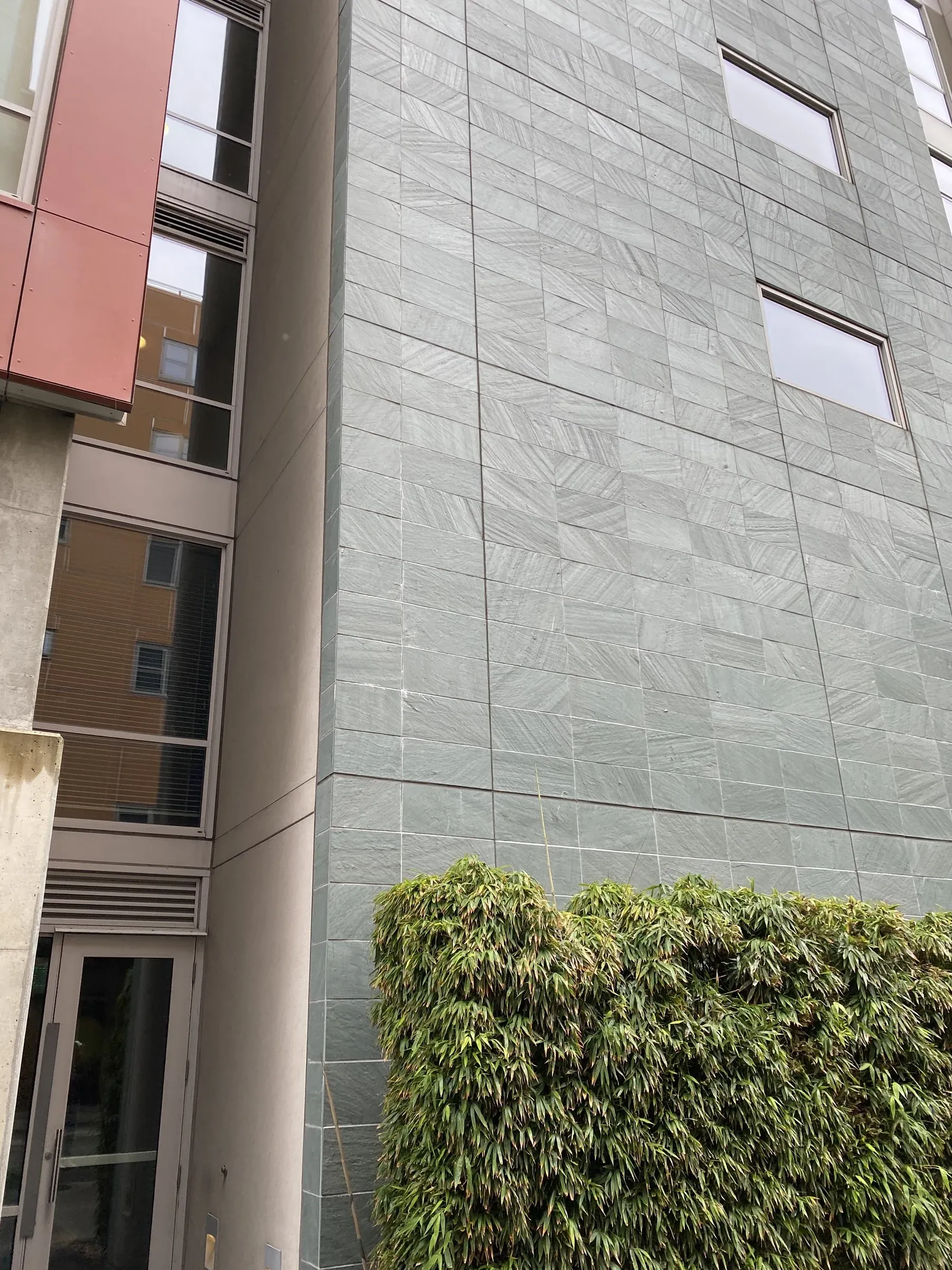 Panel joints along a facade beside recessed balconies