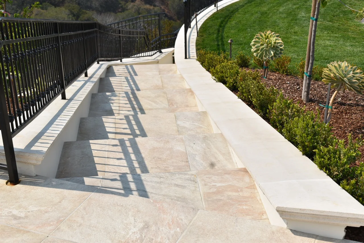 Continuous wall cap beside a curving stair