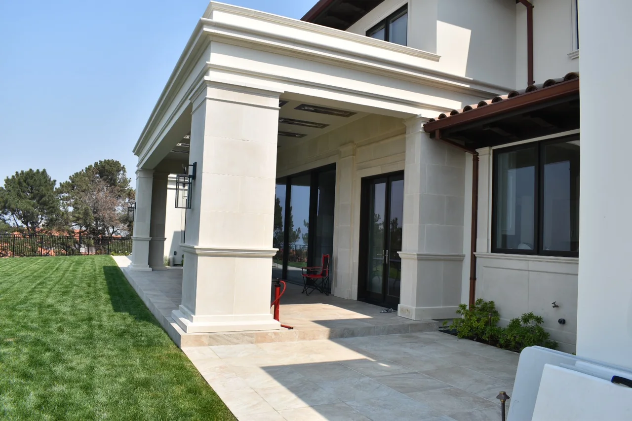 Cast stone columns and covered terrace