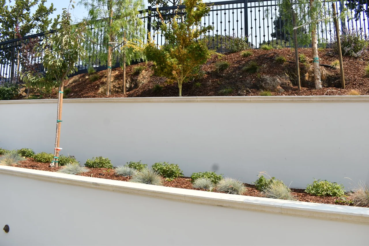 Light caps finishing stepped garden retaining walls
