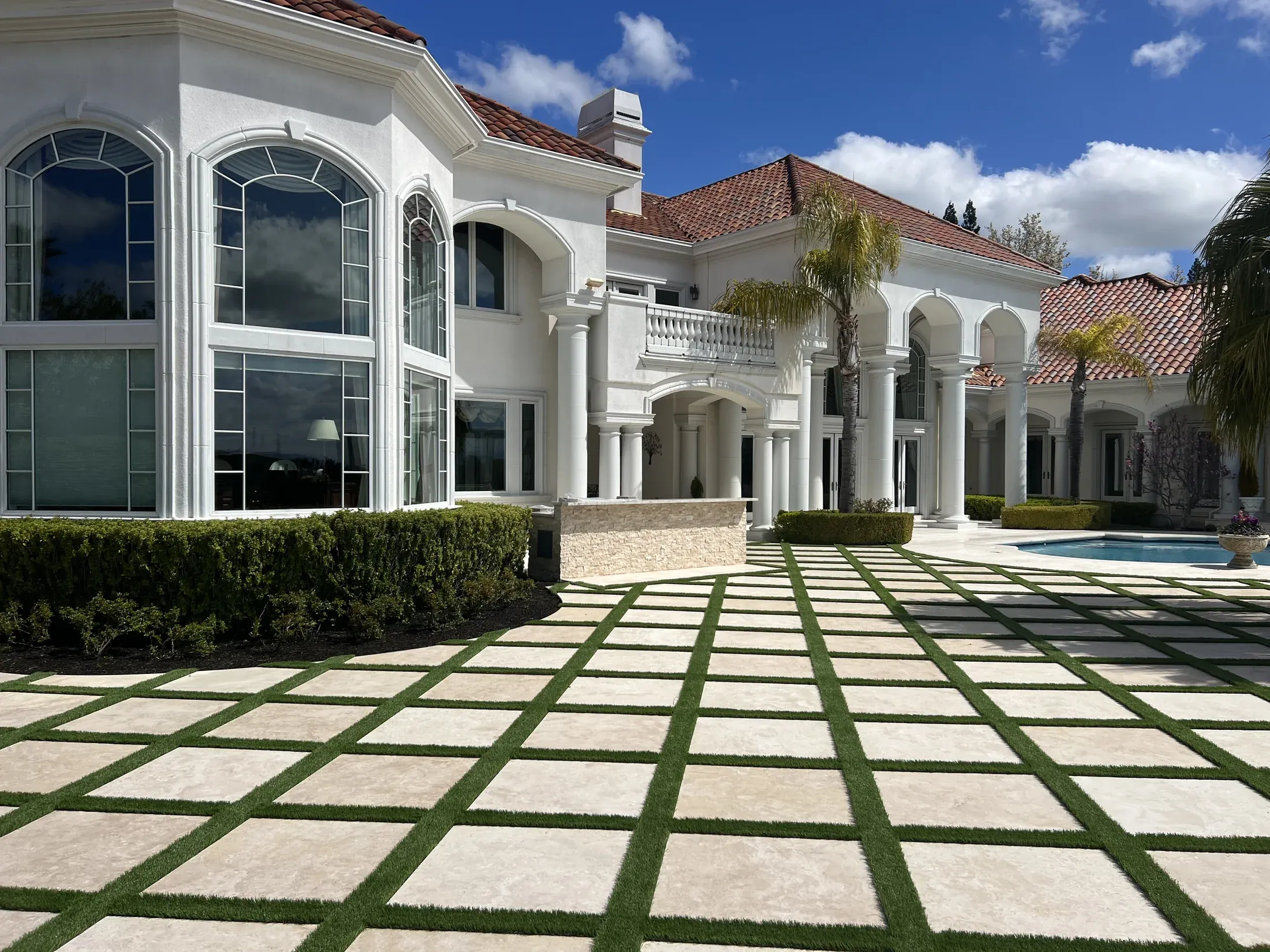 Formal residential courtyard paved in light stone
