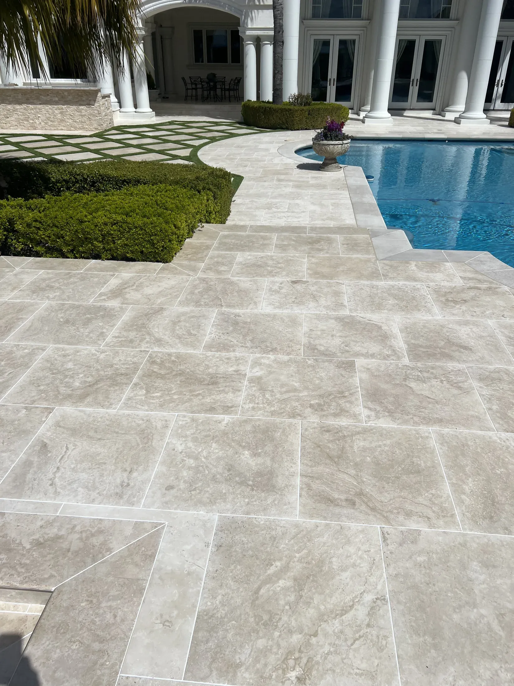 Pool deck paving and the adjoining water edge